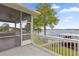 Screened porch with a view of the lake and dock at 6320 S Sylvan Lake Dr, Sanford, FL 32771