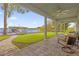 Peaceful screened porch overlooking the lake and a private dock at 6320 S Sylvan Lake Dr, Sanford, FL 32771
