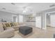 Bright bonus room featuring a wet bar and comfortable lounge area at 6320 S Sylvan Lake Dr, Sanford, FL 32771