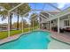 Large pool with a screened enclosure, a patio, and lake views at 6320 S Sylvan Lake Dr, Sanford, FL 32771