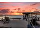 Enjoy sunsets from this spacious dock with seating area at 6320 S Sylvan Lake Dr, Sanford, FL 32771
