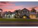 Beautiful two-story home with a three-car garage and lovely landscaping at 6320 S Sylvan Lake Dr, Sanford, FL 32771