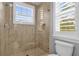 Clean bathroom with walk-in shower and window at 6320 S Sylvan Lake Dr, Sanford, FL 32771