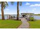 Private lakefront dock with a covered boat lift and seating area at 6320 S Sylvan Lake Dr, Sanford, FL 32771