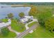 Lakefront property showcasing a spacious home and lush landscaping at 6320 S Sylvan Lake Dr, Sanford, FL 32771