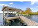 Covered boat lift on a spacious lakefront dock at 6320 S Sylvan Lake Dr, Sanford, FL 32771