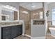 Bathroom with walk-in shower and granite countertop vanity at 6320 S Sylvan Lake Dr, Sanford, FL 32771
