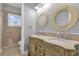 Bathroom with dual sinks and ornate vanity at 6320 S Sylvan Lake Dr, Sanford, FL 32771
