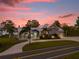 Two-story waterfront home with a circular driveway at 6320 S Sylvan Lake Dr, Sanford, FL 32771