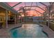 Screened pool and patio area with outdoor kitchen at 6320 S Sylvan Lake Dr, Sanford, FL 32771