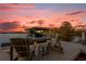 Sunset view over the lake from a relaxing dock with seating at 6320 S Sylvan Lake Dr, Sanford, FL 32771