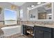 Elegant bathroom with a freestanding tub and dual vanities at 6320 S Sylvan Lake Dr, Sanford, FL 32771