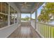 Covered porch with lake view and access to the backyard at 6320 S Sylvan Lake Dr, Sanford, FL 32771