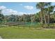 Wooden dock extending over a serene, spring-fed lake at 332 Belmond Dr, Debary, FL 32713