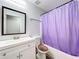 Clean bathroom with a bathtub and white vanity at 6742 Pomeroy Cir, Orlando, FL 32810