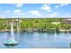 Aerial view of lakefront property with fountain and lush green landscape at 322 E Central Blvd # 1807, Orlando, FL 32801
