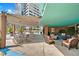 Relaxing rooftop patio with seating and shade at 322 E Central Blvd # 1807, Orlando, FL 32801