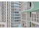 Modern high-rise building with glass and curved architecture at 322 E Central Blvd # 1807, Orlando, FL 32801