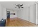 Open living area with hardwood floors and kitchen pass-through at 322 E Central Blvd # 1807, Orlando, FL 32801