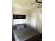 Spacious bedroom with double doors and a ceiling fan at 2521 Oneida Loop, Kissimmee, FL 34747