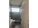Modern bathroom with a large walk-in shower and grey tile at 2521 Oneida Loop, Kissimmee, FL 34747
