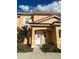 Attractive two-story townhome with a white door at 2653 Roadster Ln, Kissimmee, FL 34746