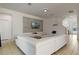 Bright living room featuring a large sectional sofa and built-in media wall at 4511 Monado Dr, Kissimmee, FL 34746