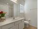 Bathroom with a toilet, sink and vanity at 4511 Monado Dr, Kissimmee, FL 34746