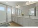 Elegant bathroom featuring double vanity and walk-in shower at 4511 Monado Dr, Kissimmee, FL 34746