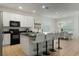 Modern kitchen with white cabinets, a large island, and stainless steel appliances at 4511 Monado Dr, Kissimmee, FL 34746