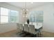 Elegant dining room with a large white table and modern white chairs at 4511 Monado Dr, Kissimmee, FL 34746