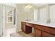 Double vanity bathroom with a shower and plenty of storage at 2615 Archfeld Blvd, Kissimmee, FL 34747