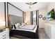 King bedroom with gray upholstered headboard and modern decor at 4537 Target Blvd, Kissimmee, FL 34746