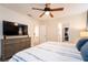 Spacious bedroom with a large TV and dresser at 4537 Target Blvd, Kissimmee, FL 34746