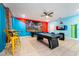 Game room featuring pool table, air hockey, and a large mural at 4537 Target Blvd, Kissimmee, FL 34746