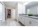Modern bathroom with double vanity, gray countertop and tile floors at 4537 Target Blvd, Kissimmee, FL 34746