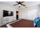Bedroom with king-size bed and large TV at 4537 Target Blvd, Kissimmee, FL 34746