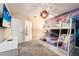 Frozen themed bedroom with a bunk bed, TV, and adjoining bathroom at 4537 Target Blvd, Kissimmee, FL 34746