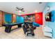 Fun game room with pool table, gaming chairs, and vibrant wall art at 4537 Target Blvd, Kissimmee, FL 34746