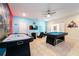Fun game room with pool table, air hockey, and gaming setup at 4537 Target Blvd, Kissimmee, FL 34746