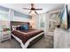 Primary bedroom with king bed and large artwork at 4537 Target Blvd, Kissimmee, FL 34746