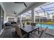 Screened patio with dining area and pool view at 4537 Target Blvd, Kissimmee, FL 34746