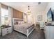Spacious main bedroom with a comfortable king-size bed and en-suite bathroom at 8896 Cabot Cliffs Dr, Davenport, FL 33896
