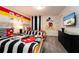 Mickey Mouse themed bedroom with two twin beds and wall art at 8896 Cabot Cliffs Dr, Davenport, FL 33896