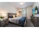 Guest bedroom with a TV and plenty of space at 8896 Cabot Cliffs Dr, Davenport, FL 33896