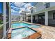 Relaxing screened pool and spa with patio at 8896 Cabot Cliffs Dr, Davenport, FL 33896