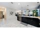 Modern kitchen with island, stainless steel appliances, and dark cabinetry at 8896 Cabot Cliffs Dr, Davenport, FL 33896