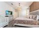 Spacious main bedroom with ensuite bathroom and TV at 8896 Cabot Cliffs Dr, Davenport, FL 33896