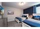 Bedroom with two twin beds and a pirate map at 8896 Cabot Cliffs Dr, Davenport, FL 33896