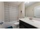 Clean bathroom with shower/tub combo, vanity, and updated fixtures at 8896 Cabot Cliffs Dr, Davenport, FL 33896